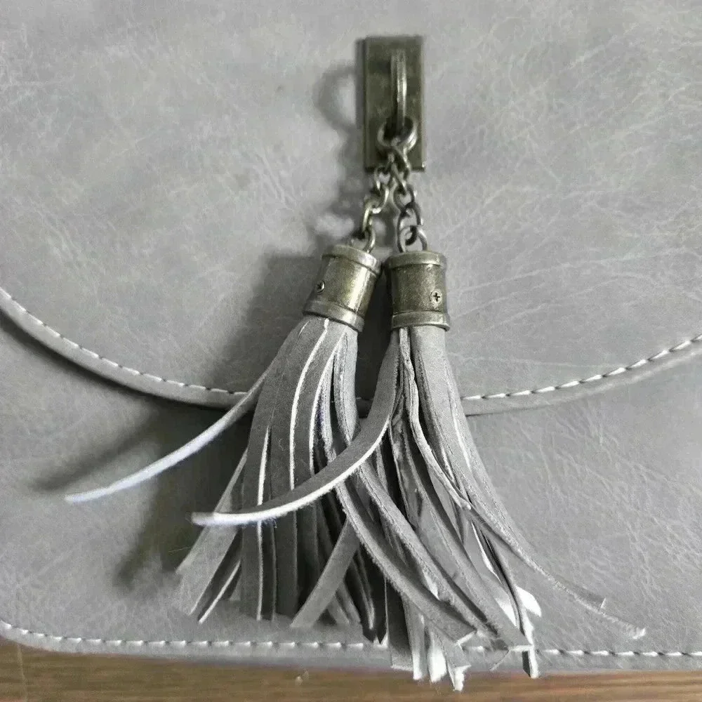 Grey crossbody boho festival bag with tassels from J francis